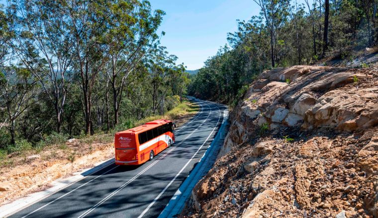 A NSW Trainlink Coach driving up a hill