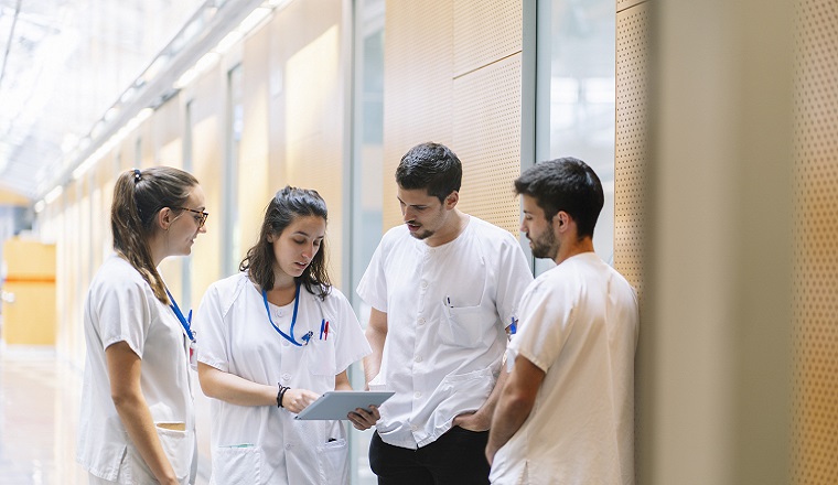 Healthcare Professionals Collaborating, Such As A Group Of Doctors, Nurses, And Pharmacists Discussing Or Working Together