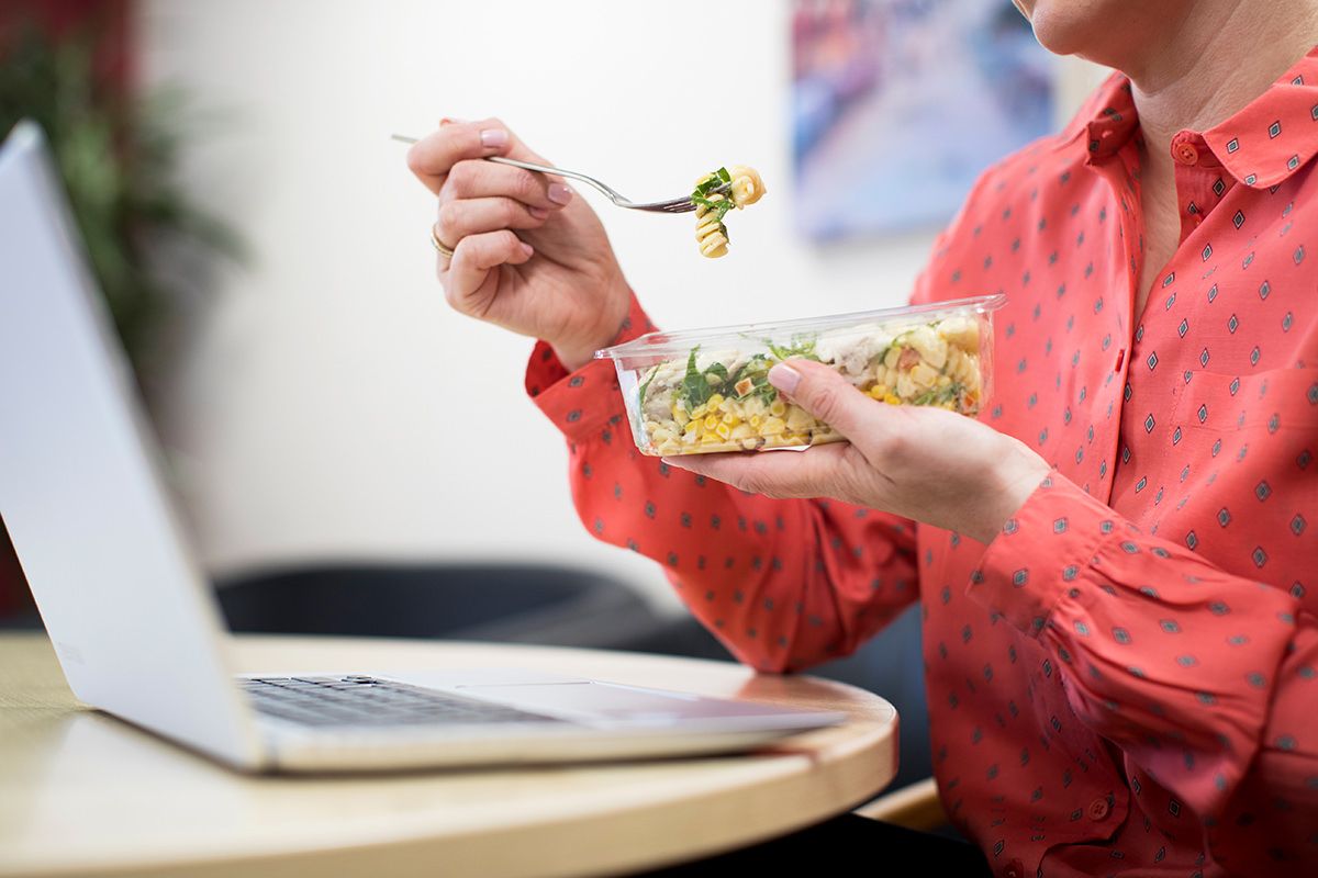 Person eating from container