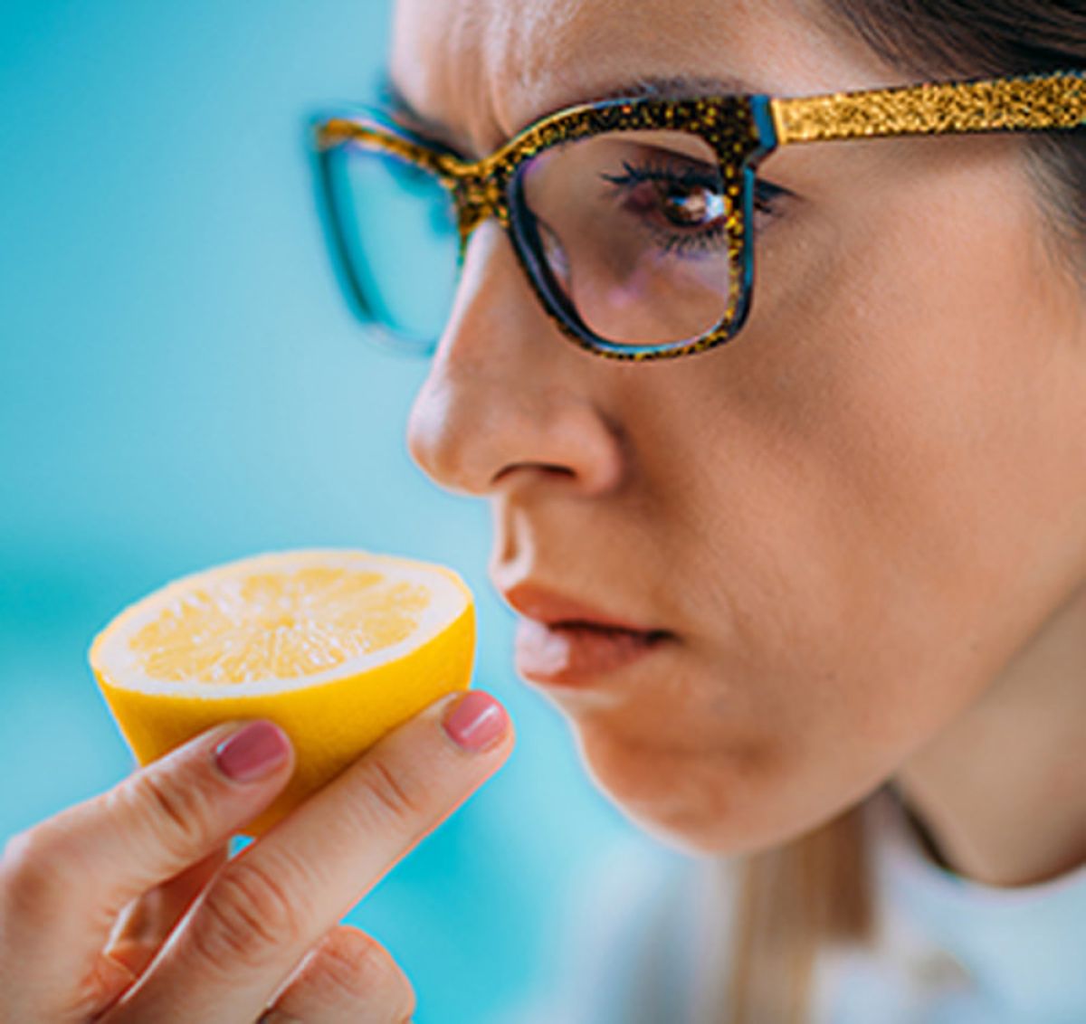 Person smelling a lemon