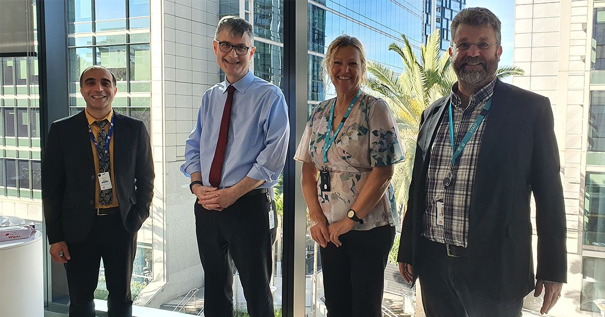 Photo of the trial partners from NSW Health and Health Education and Training Institute (HETI) in an office setting