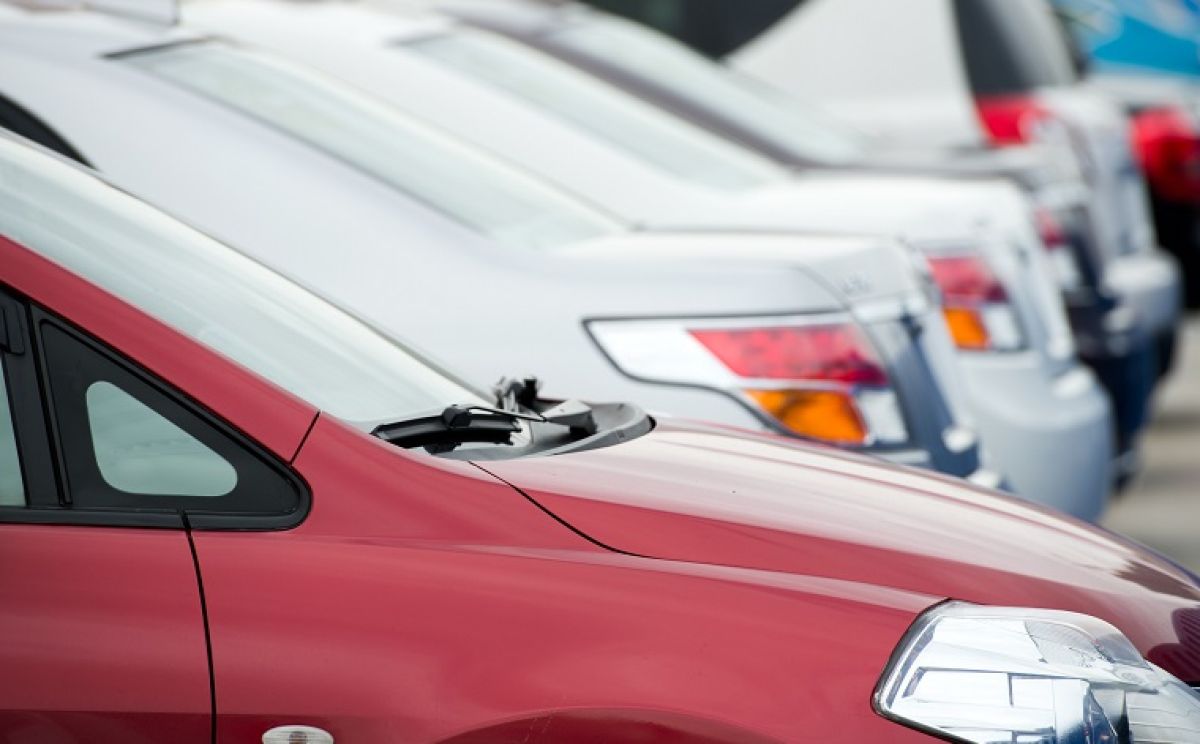 A line of cars in a carpark.