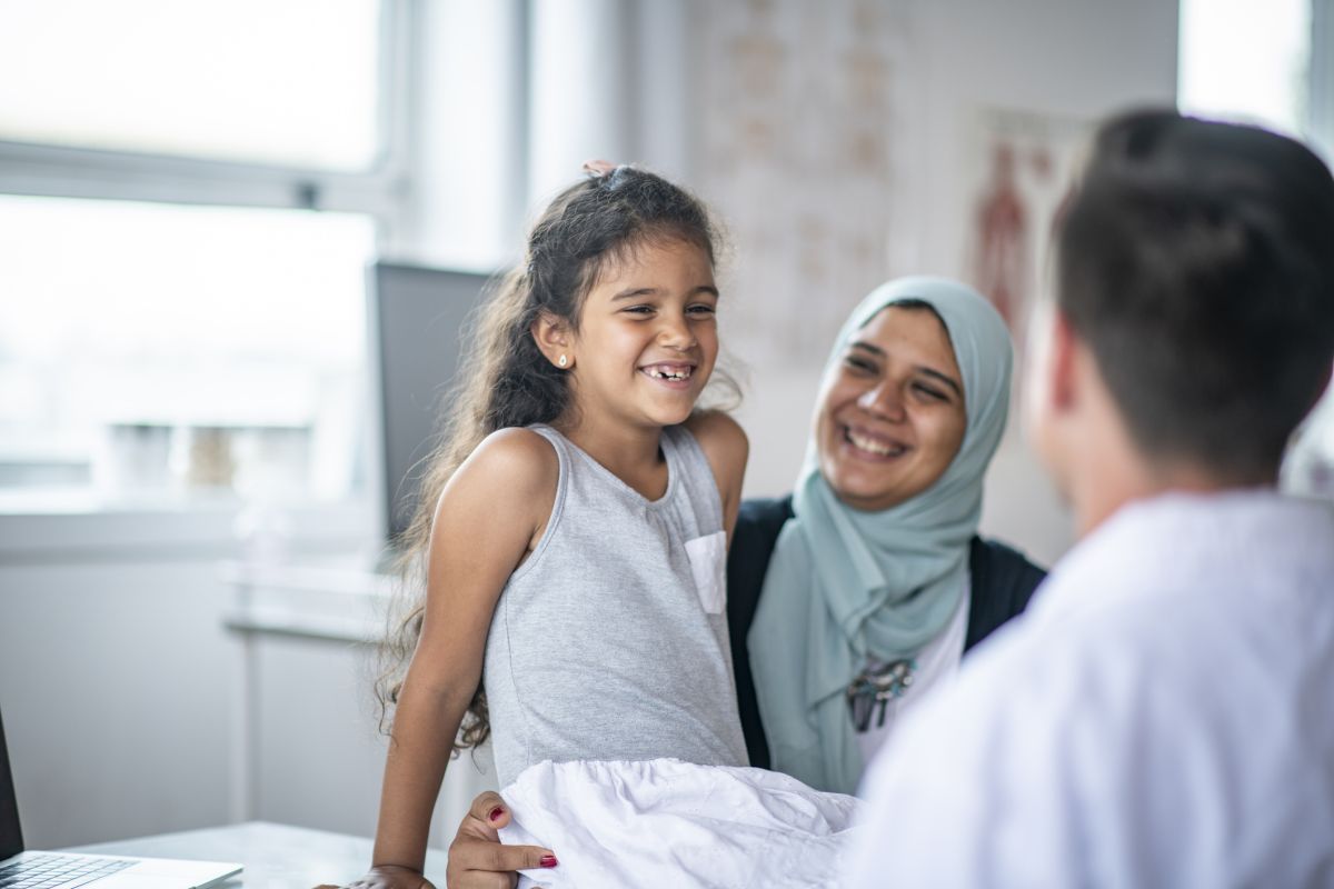 Mother and daughter refugee at health clinic seeing their doctor in NSW