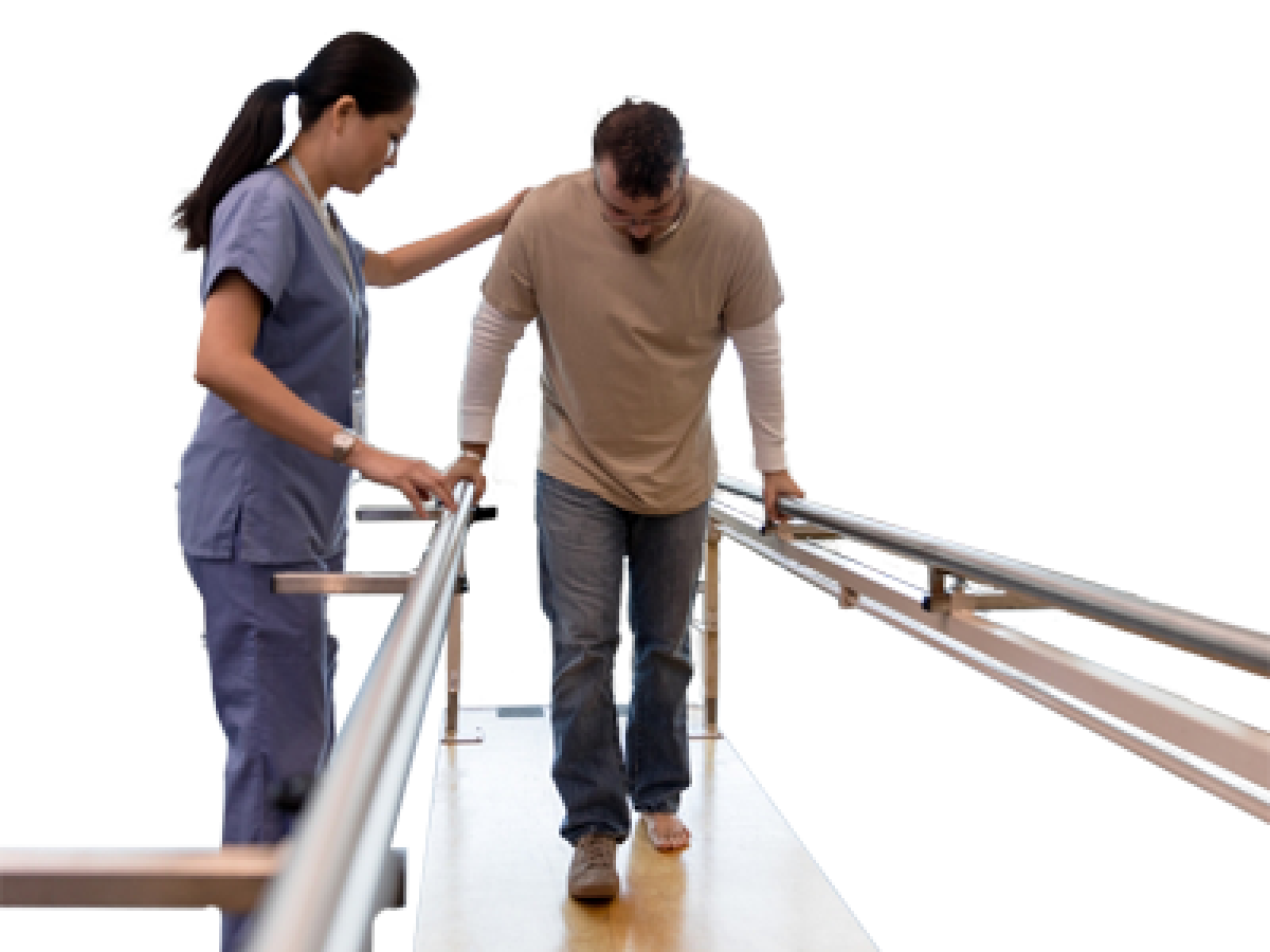 An occupational therapist helping a person walk.