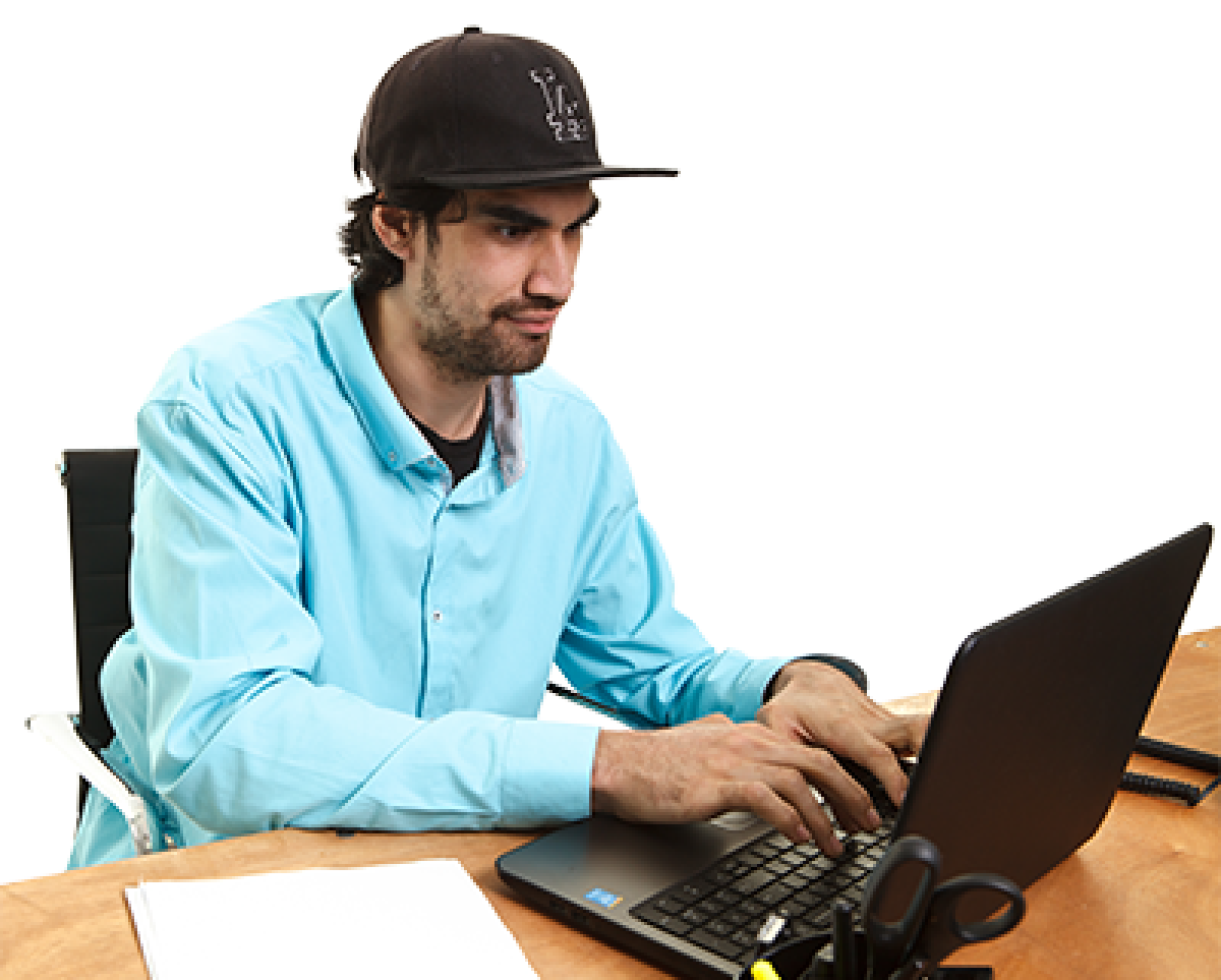 A man at a computer viewing how to apply to TAFE