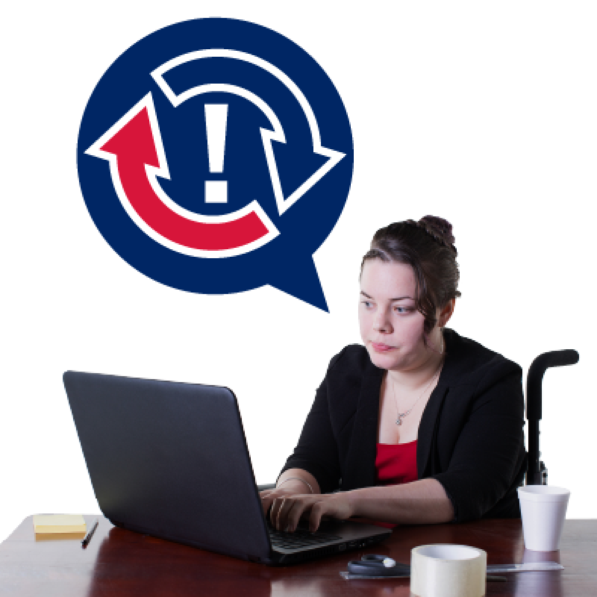 A woman is sitting in her wheelchair at a table using her laptop.