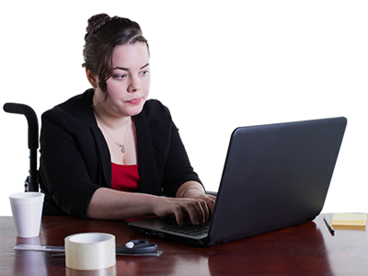 A woman looking at her computer to find out more information.