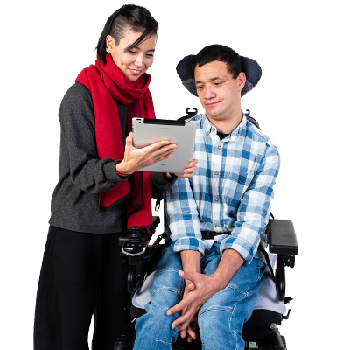 A family or friend is helping a person with a disability complete their application on a tablet.