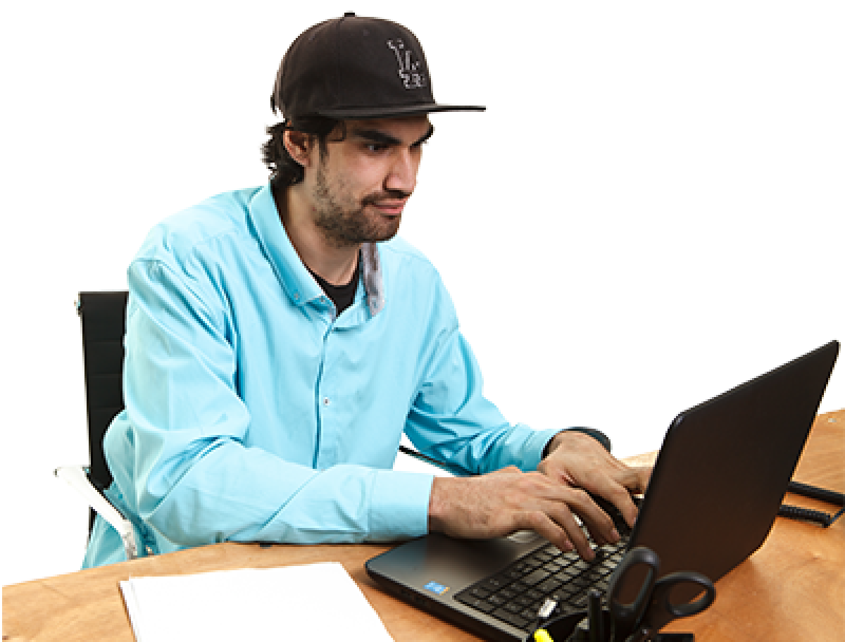 A man at a desk using a laptop