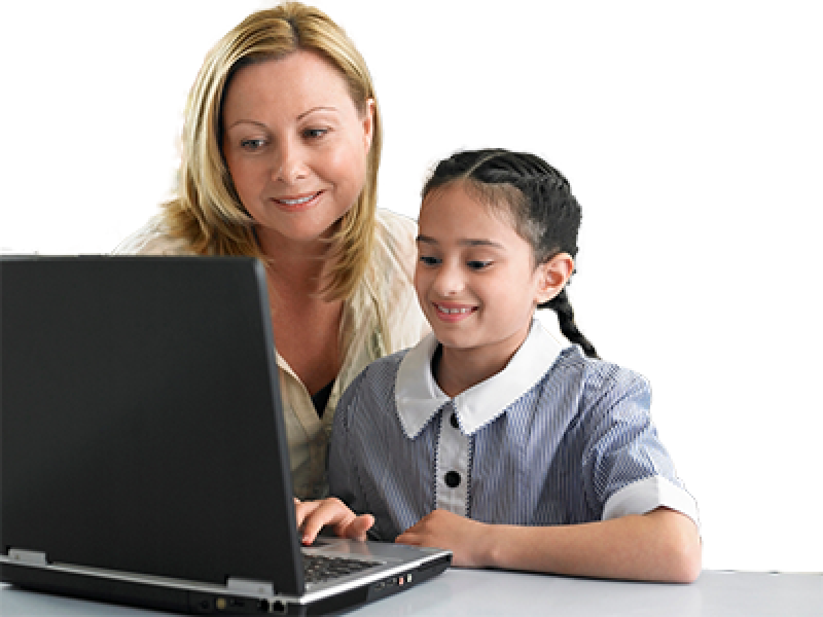 A schoolgirl with her mother using a computer