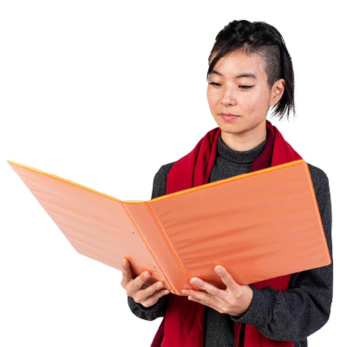 A person reading a document from a folder