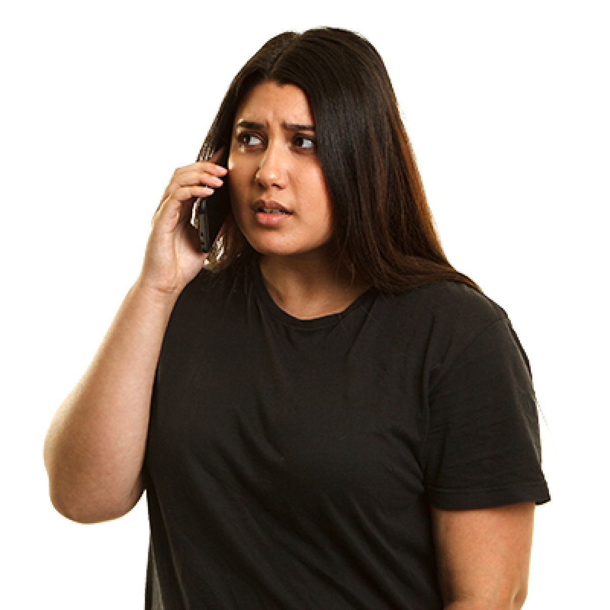 A person who looks upset talking on the phone.