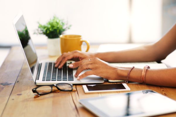 Woman typing on laptop