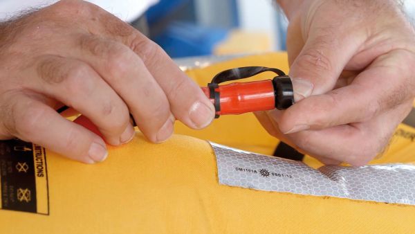 Lifejacket user checking the bladder