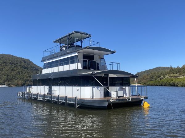 A moored houseboat on water