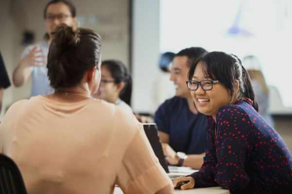 team of professionals in discussion at a table