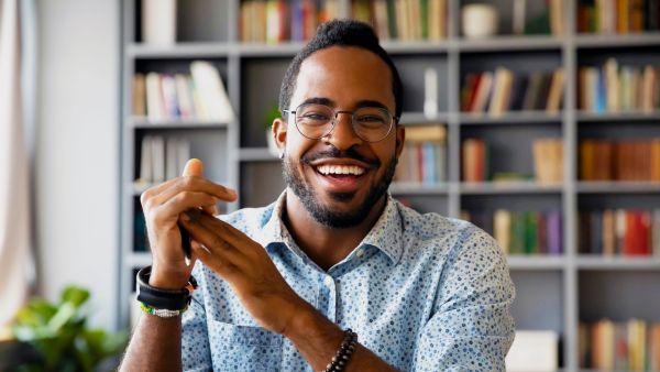 Smiling employee sit in coworking space