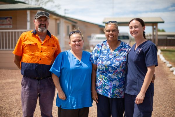 Staff members from Goodooga Health Service gather out the front of the facility