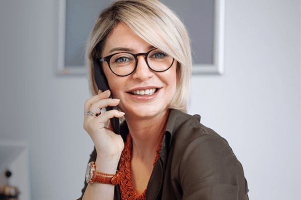 A woman holding a mobile phone.