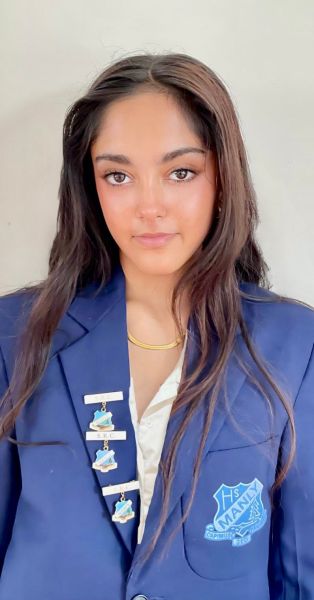 Teenager girl with long hair and her school blazer with several medals