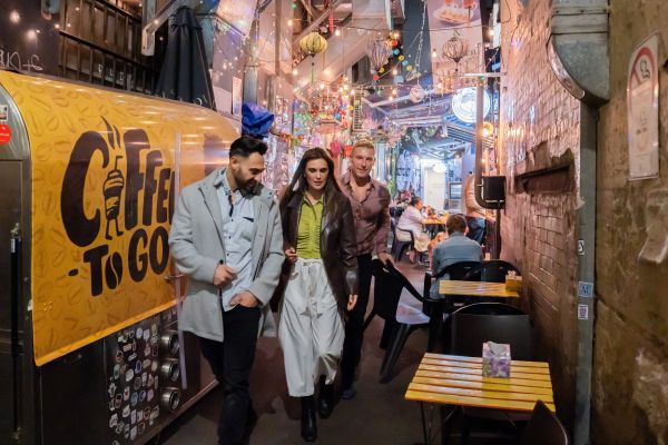 Man and woman walking in alleyway