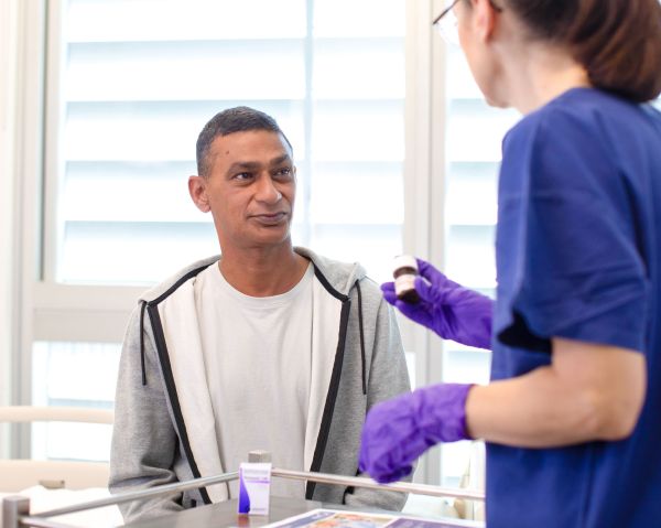 Medical worker with male patient 