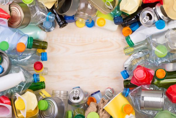 table full of recycled cans and bottles 