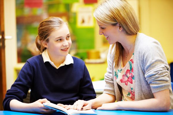 A teacher and student interacting 