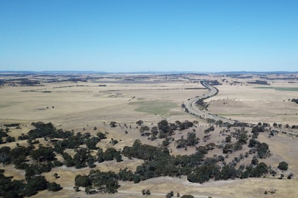 Expansive open plain in NSW with blue sky.