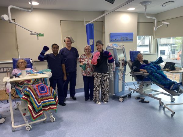 Patients and staff from Cooma Hospital's Renal Unit with the donated arm warmers