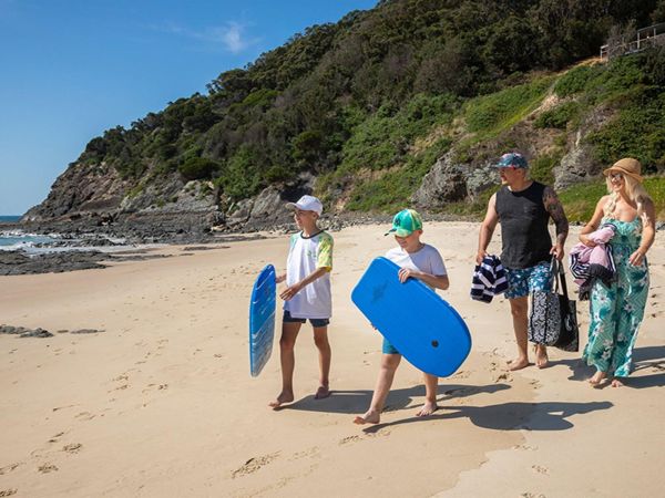 A family enjoying Boat Beach near Davies Cottage, Myall Lakes National Park. Credit: Brent Mail