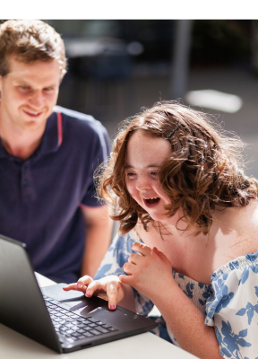 Happy young person working at computer