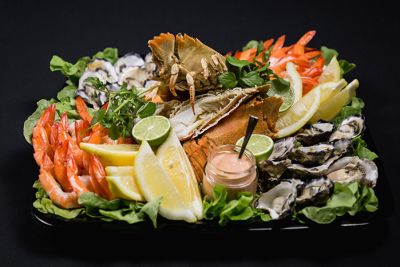 A platter of artfully assorted fresh seafood. 