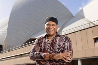 Image of chef Mark Olive standing outside Sydney Opera House 