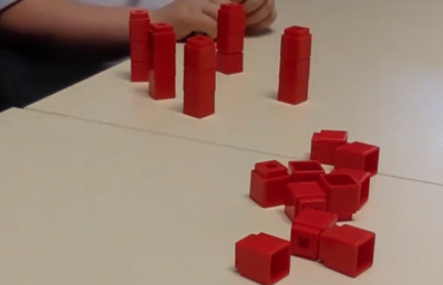 Red building blocks on a table