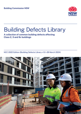 Building defects library cover, two staff in high-vis clothing having a discussion in front of an apartment construction site
