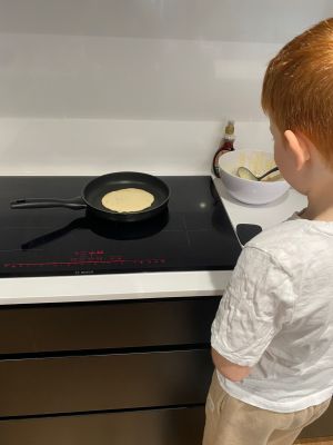 Early stage 1 child in home schooling cooking class