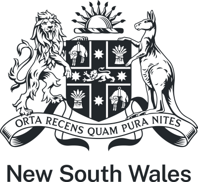 The NSW State Arms in grey which features a kangaroo and lion holding a shield with a sun above it. Below the shield are the words 'Orta recens quam pura nites'. The shield has 4 sections divided by a red cross with a lion in the centre and 4 stars. Within the 4 corners there are 2 with sheep and 2 with bunches of wheat. 