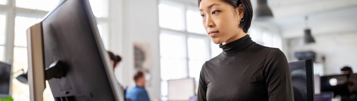 Woman programming at a computer