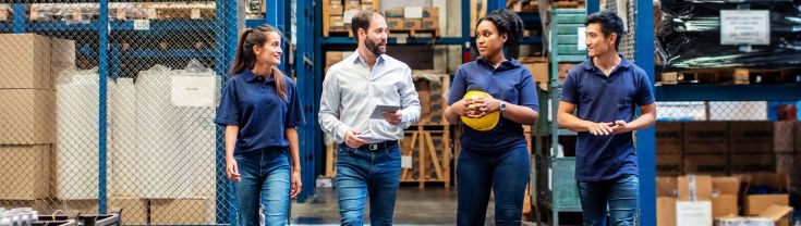 People walking through a warehouse