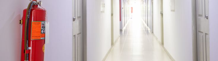 Image of a fire extinguisher in a hallway