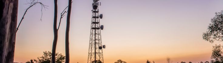 Radio tower in rural setting.