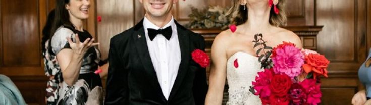 bride and groom smiling and holding hands