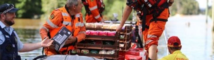 An SES boat delivering supplies to flood-stricken communities