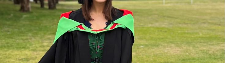 Woman wearing cap and gown for graduation