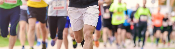 A group of people running in a charity race event