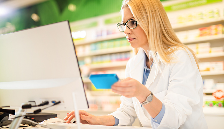 Health professional looking at a computer monitor