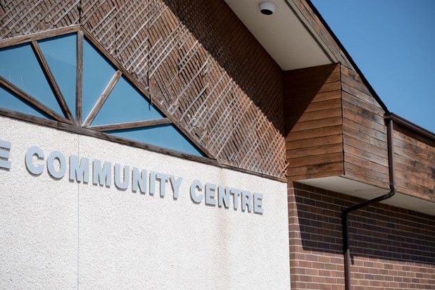 A wall of a building with the words community centre 