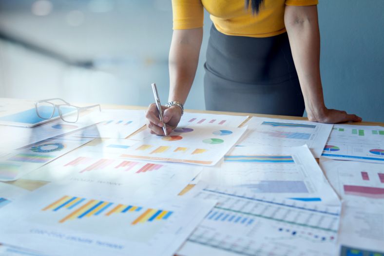 Image of woman looking at evaluation documents