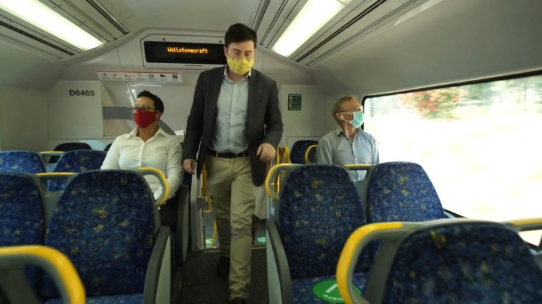 Commuters wearing a face mask on a NSW train